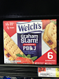 we are looking at a box of graham's cream strawberry pb & j crackers