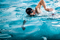 Young man swimming the front crawl in a pool by Oleksandr Boiko on 500px