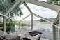 mirrored glass cabin with panoramic views disappears into finland's rich natural landscape