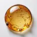 A golden spherical liquid against a pure white background, with a top view perspective, less molecular structure, joints, and style that possess realistic elements. The realistic still life composition style has clear layers and is semi transparent
