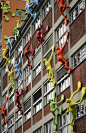 Sculptures called ‘Flossis’ By German artist Rosalie, on a building in Duesseldorf, Germany. art installation: 