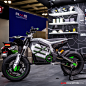 Photo by AutoConception.com on November 13, 2023. May be an image of racing vehicles, scooter, motorcycle, wheel and text.