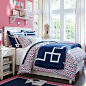 Great colorful girl's room idea from  PB Teen Pink and Navy.. Love those shelves!