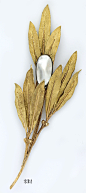 Mother-of-pearl and carved gold leaf brooch. Buccellati