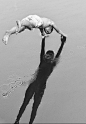 Little boy jumping in the water. Magnificent shadow: 