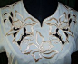 Blouse with single-colored cutwork embroidery