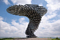 A 3-meter-tall, wind-powered musical sculpture made of galvanized steel pipes, it stands high above the English town of Burnley. The pipes swirl to form the shape of a tree bent and blown by the wind, and produce an eerie, melodious hum as the constant wi
