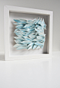wall tile, School of Fish, sculptural ceramic artwork , white, light blue, nautical wall decor, seaside home decor, wall hanging. via Etsy.