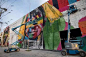 【世界最大涂鸦亮相里约奥林匹克大道】巴西里约热内卢，艺术家Eduardo Kobra在奥林匹克大道创作世界最大的涂鸦作品。这幅作品叫“Ethnicities”，表达的是来自五大洲的运动员共同参与到奥运会这项运动盛会中来。
