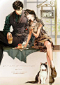 This may contain: a man and woman sitting at a table next to a cat