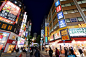 TOKYO, JAPAN - NOVEMBER 29, 2016: People visit night Ikebukuro district of Tokyo, Japan. Tokyo is the capital city of Japan. 37.8 million people live in its metro area.