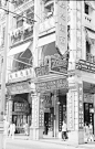 photo2741-(ca. 1940s) Hong Kong, English and Chinese language shop signs covering building