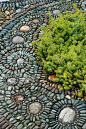 路〜Jeffrey Bale. Photo: Courtesy Josh Mccullough    ART UNDERFOOT  Northeast Portland garden designer and artist Jeffrey Bale designs each mosaic according to the site—and the aesthetics of the homeowner. Here, mosaic art in Nancy Goldman’s garden is plant