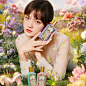 Chen Wen Qi stars in campaign for Gucci Flora Gorgeous fragrances. She lies resting on her arms in a field filled with brightly coloured flowers, while holding Gucci Flora Gorgeous Magnolia to her cheek. She wears an ethereal white top and looks directly 