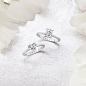 Two Graff Paragon Engagement Rings on a table with white petals