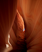 Image may contain cave, person and canyon