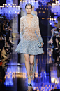 #婚纱#ELIE SAAB 2014秋冬高订婚纱礼服，流光异彩的梦境。婚纱雍容华贵，轻灵的珍珠白刺绣薄纱，自腰间一泻而下，仿如盛放的繁花。Elie Saab捕捉巴黎明亮璀璨的美态，以如梦似幻的虹彩光泽，筑起华丽的宫殿。