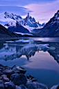 From EarthShots.Org Photo Of The Day; July 13, 2015:
Cerro Torre ReflectionMei Xu
This image was taken at Laguna Torre, El Chalten, Argentina. In that evening lenticular clouds like UFO were sitting around Cerro Torre. In a moment I was wondering if I wa