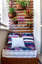 Adorn your balcony with potted plants hanging on your furnished wooden wall. You can add a small bed that can also be your chair below. Enjoy the view from your balcony and the fresh air from the plants.