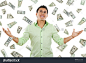Stock image of money falling around young man