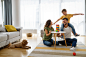 happy-young-family-having-fun-time-playing-together-home-with-dog