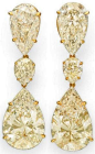 Colored diamond earrings. Each suspending a pear-shaped fancy light brownish yellow diamond or light yellow diamond, weighing approximately 10.07 and 10.06 carats, from an inverted pear-shaped light yellow diamond link, weighing approximately 5.03 and 5.0