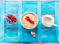 Oats and berries on blue textured background by Sofya Bolotina on 500px