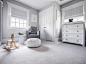 Photo of a medium sized classic gender neutral nursery in New York with grey walls, carpet and grey floors.