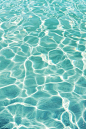 Abstract photograph of water movement, creating a texture with light reflections. Photo by Ulchiva.