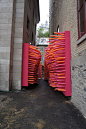 Hundreds of pool noodles invade an abandoned alley in Québec City, Canada, for the Delirious Frites installation created by creative collective Les Astronautes.