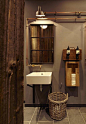 The restroom is decorated in warm brown tones, photo © Katrin Binner