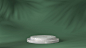 Luxury white marble cylinder podium in shadow leaves background Premium Photo