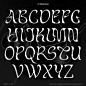 the upper and lower letters are in white ink on black paper, with some type of lettering