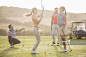 Women high fiving on golf course_创意图片