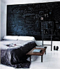 An entire wall painted in chalkboard paint in the bedroom of German fashion designer Hanne Graumannr (via 5 Quick Fixes: Instant Headboards&#;160: Remodelista)