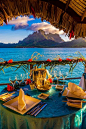 Romantic private catered dinner on the deck of an overwater bungalow ~ Four Seasons Resort Bora Bora, French Polynesia.: 