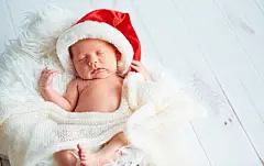 sleeper newborn baby in  Christmas Santa cap