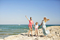 Mother and two daughters on the beach having fun, Barcelona, Spain by RooM_the_Agency on 500px