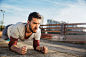 Photo of a young athletic man exercising outdoors : Stock Photo