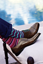 Tip: With whimsical socks and bright laces, you can turn a favorite pair of shoes into a new pair. (Paul Smith, $30)