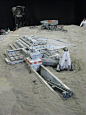 其中可能包括：a model of a space station in the sand