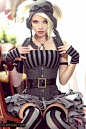 Steampunk couture mixing many futuristic & Victorian elements to create this adorable outfit. Adorned with an Aviator's hat & goggles mixed with the classic Victorian cameo necklace paired with bold black & charcoal striped bustier & fabri