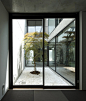 This house for a surgeon in Chiba, Japan, by Apollo Architects & Associates contains courtyards with elevated wooden walkways and glass walls behind its thick concrete exterior (+ slideshow).