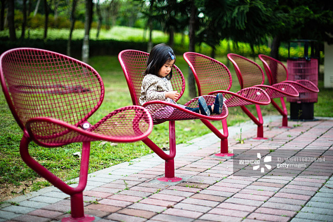 Toddler girl sitting...