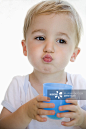 Toddler boy drinking from glass