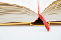 Royalty-free Image: Open book with red book marker ribbon Close…