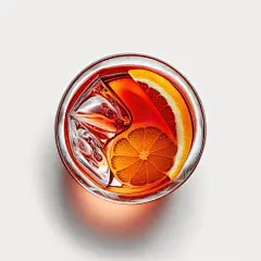 A glass of campari vermute negroni with orange slices and ice cubes top  view generative ai | Premium AI-generated image