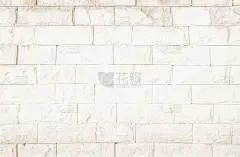空背景宽奶油色砖墙纹理。旧棕色砖墙混凝土或石材图案自然，壁纸石灰石抽象地板/网格不均匀的室内家居装饰
