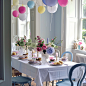 birthday-table-decoration-with-sweets-flowers-candles-pink-balloons