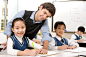 Teacher assisting student in class by blue_jean_images on 500px